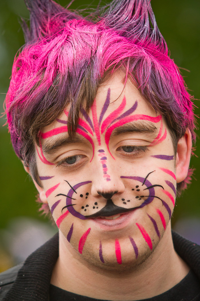 Child with face paint and hair paint pink purple 201209034433 - Alaska  State Fair